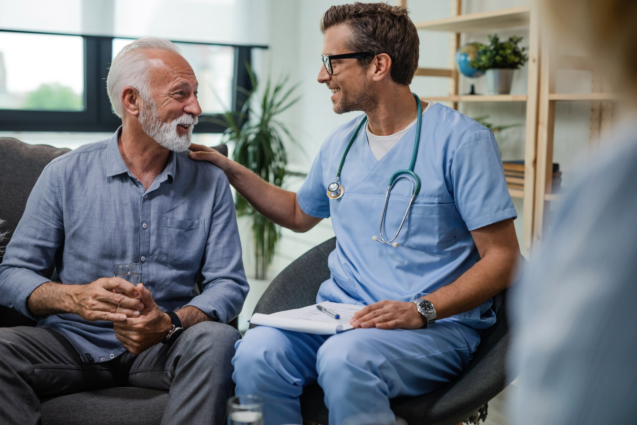 patient and house call doctor smiling during a visit